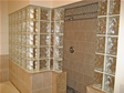 Decorative glass blocks add a creative touch and beautiful privacy wall to this master bath shower