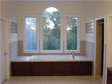 Specialty windows and Jacuzzi tub are the focal point of this master bathroom in Millstone Twp, NJ 