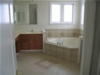 Elegant tile floor and whirlpool surround enhances this master bathroom in Monmouth County, Monmouth Beach, NJ