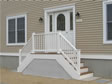 Specialty door with half glass sidelites adorn the front entry of this Ocean County modular home