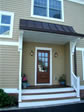 RBA designed this recessed side entry with small porch to have easy access to the side driveway