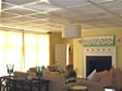 Large sliding glass door lets much light into this lovely living room with fireplace and decorative ceiling