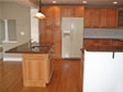 Classic oak cabinets and center islands are popular kitchen designs in many RBA modular homes