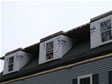 Close-up of a triple roof dormer installed on this cape modular home in Monmouth County, Atlantic Highlands, NJ